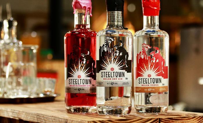 Steeltown Commemorative Welsh Gins and Vodka on the bar at Spirit of Wales distillery